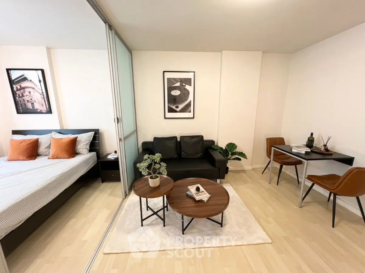 Modern studio apartment with stylish decor and cozy living area.
