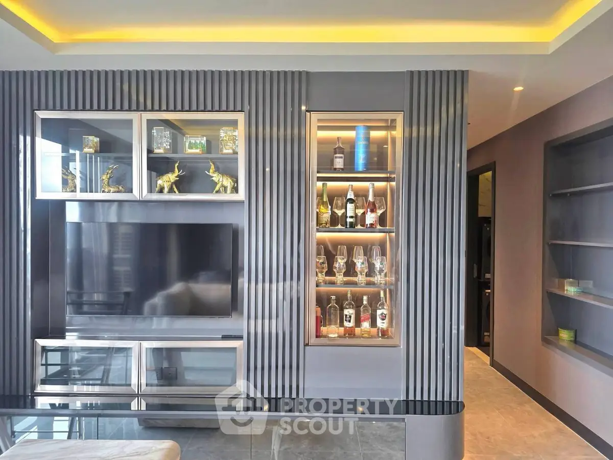 Luxurious living room with modern entertainment center and stylish decor