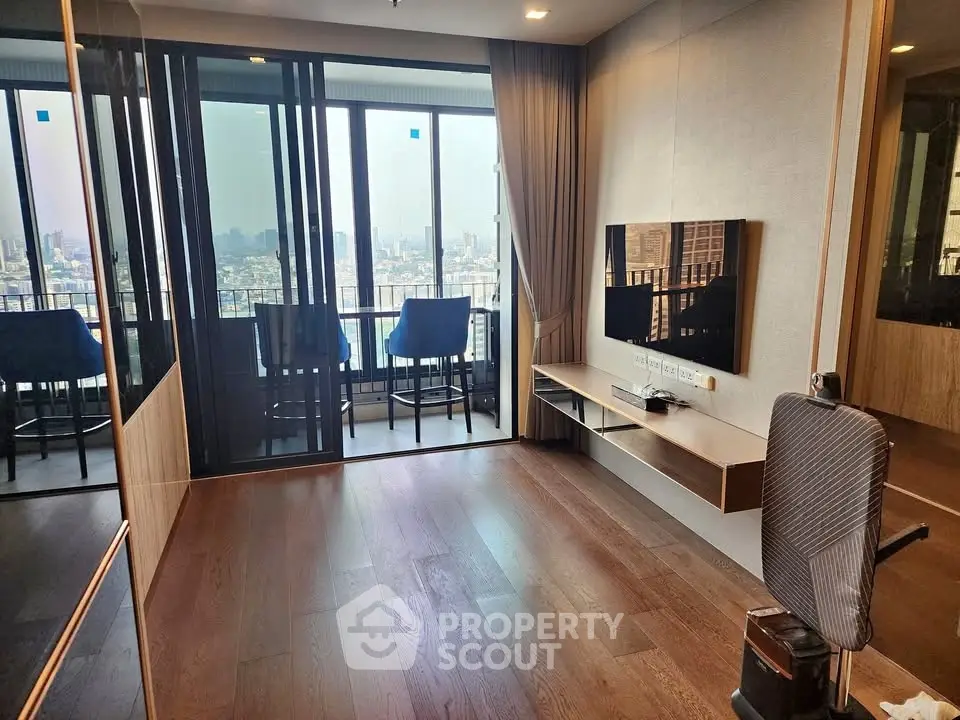 Modern living room with city view and balcony access, featuring sleek wooden flooring and contemporary decor.