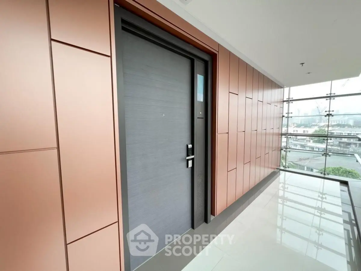 Modern apartment entrance with sleek design and city view