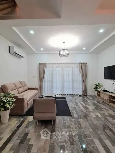 Spacious modern living room with elegant decor and natural light