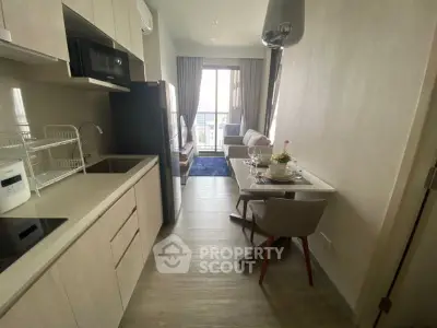 Modern apartment interior with open kitchen and cozy dining area