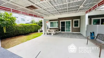 Spacious covered patio with garden view in modern home