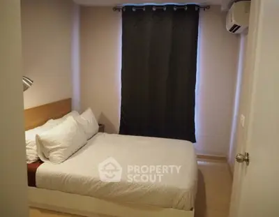 Cozy bedroom with modern decor and air conditioning unit