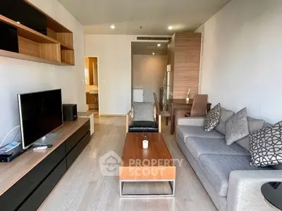 Modern living room with sleek furniture and open layout, perfect for stylish urban living.