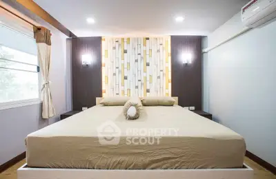 Modern bedroom with stylish decor and ambient lighting