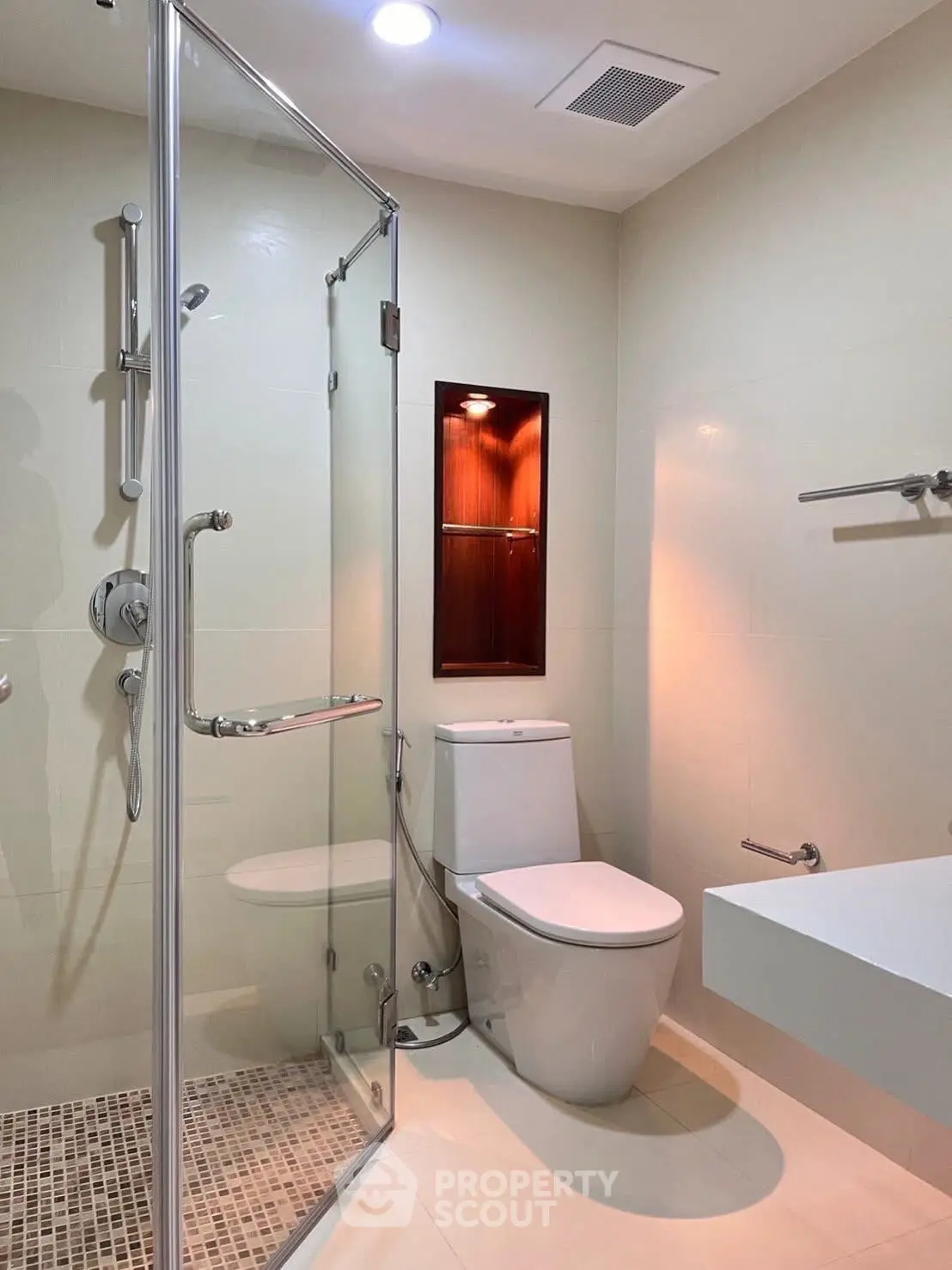 Modern bathroom with glass shower and sleek fixtures