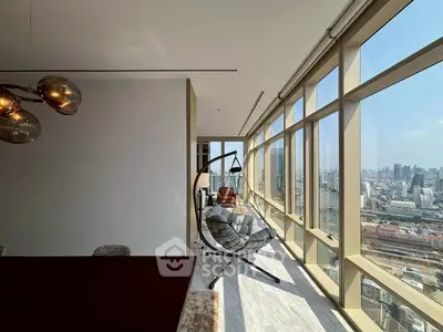 Luxurious high-rise apartment with panoramic city views and modern interior design.