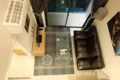 Modern living room with leather sofa and balcony view in stylish apartment