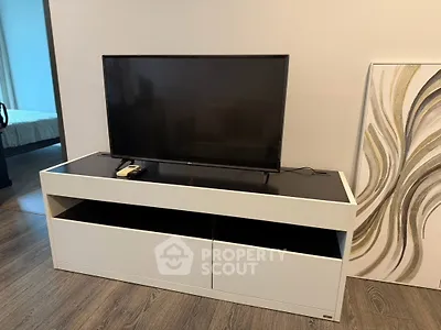 Modern living room with sleek TV stand and contemporary decor