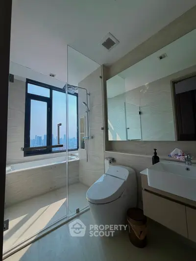 Luxurious bathroom with city view, featuring modern fixtures and elegant design.