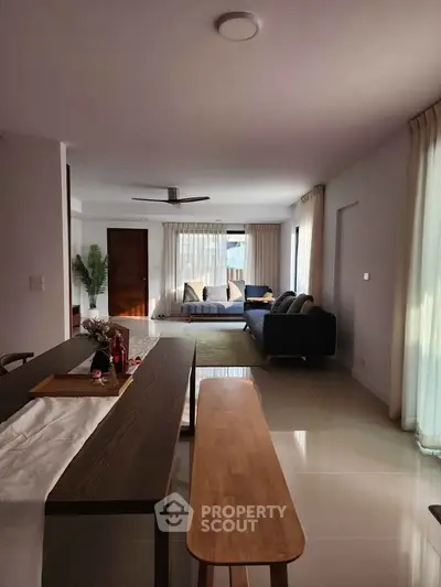 Spacious modern living room with elegant decor and natural light