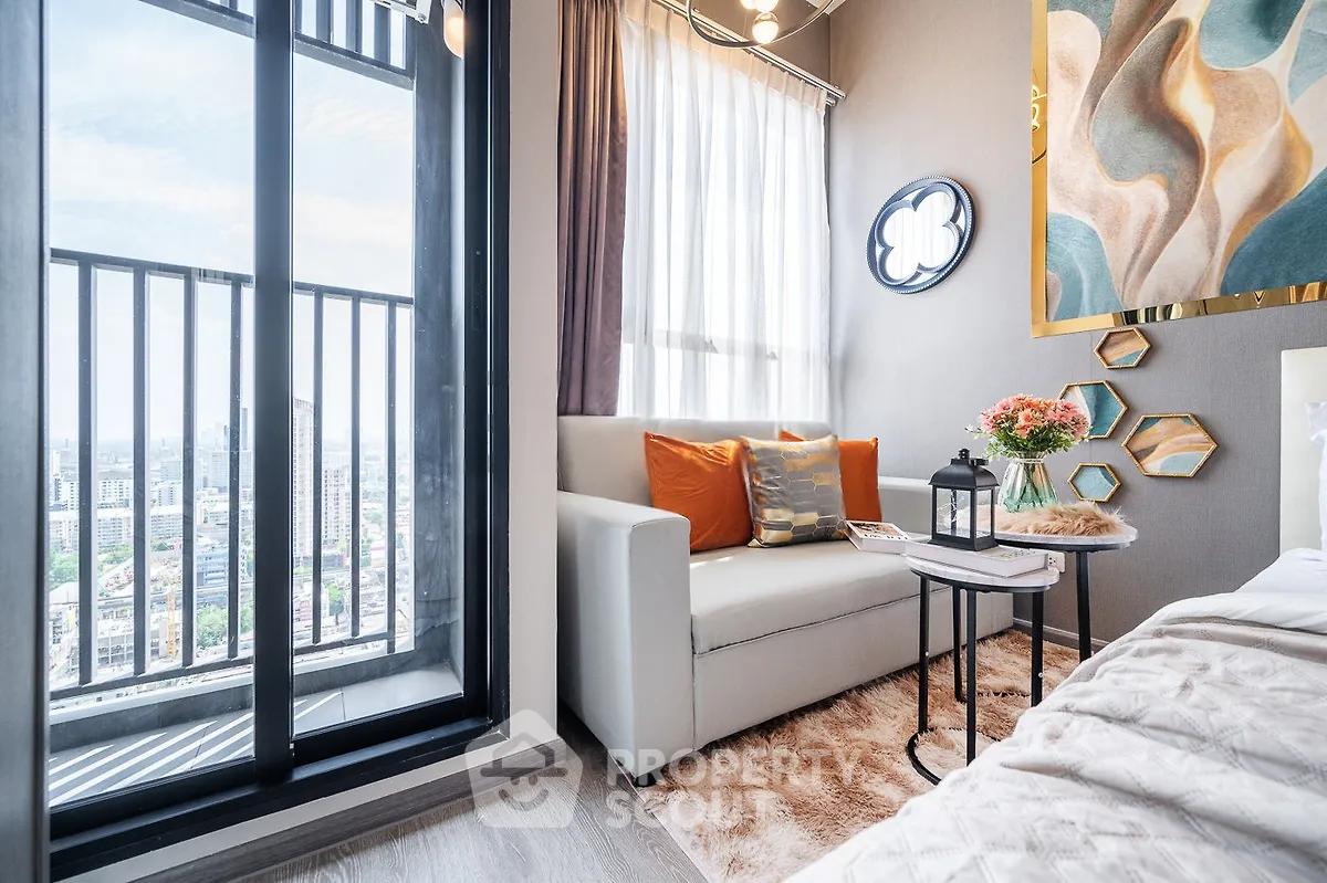 Chic modern living room with balcony view, stylish decor, and cozy seating area.