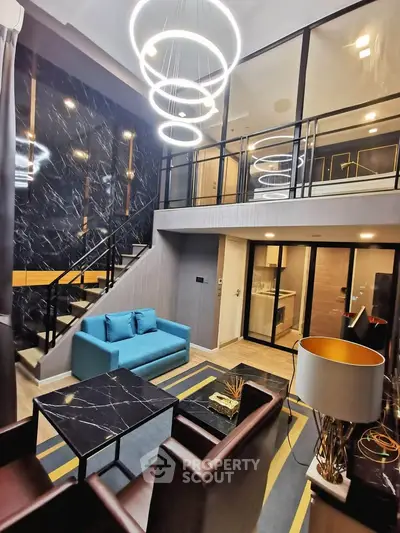 Luxurious modern living room with high ceiling and stylish mezzanine in a contemporary apartment.