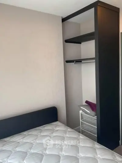 Modern bedroom with built-in closet and comfortable mattress