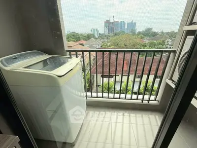 Charming balcony with washing machine and scenic city view
