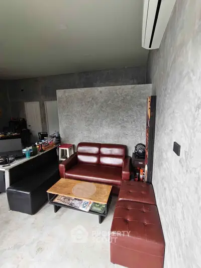 Modern living room with stylish leather furniture and minimalist decor