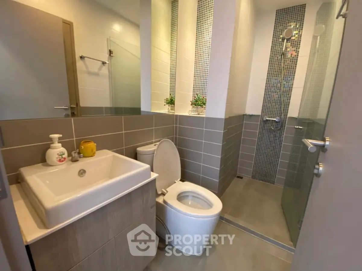 Modern bathroom with sleek design and glass shower enclosure