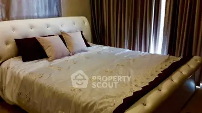 Luxurious bedroom with elegant bed and stylish curtains