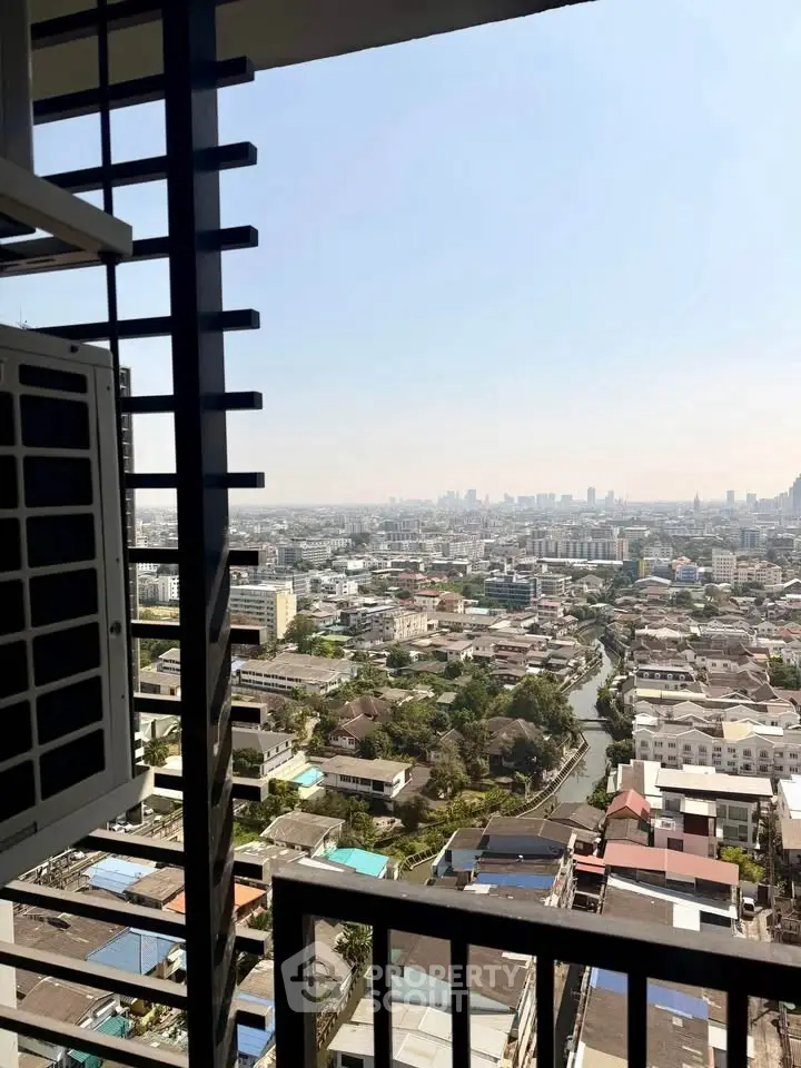 Stunning high-rise city view from a balcony overlooking urban landscape and skyline.