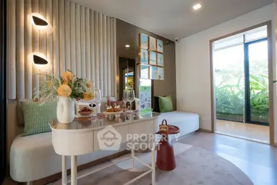 Modern living room with elegant decor and large windows overlooking greenery.