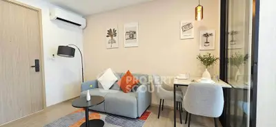 Modern living room with cozy seating and stylish decor in a contemporary apartment.