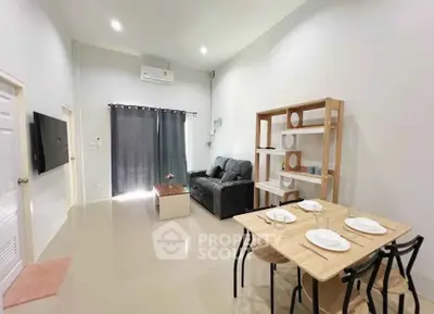Modern living room with sleek furniture and open layout, perfect for contemporary living.