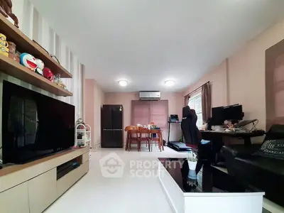 Spacious living room with modern decor and entertainment setup