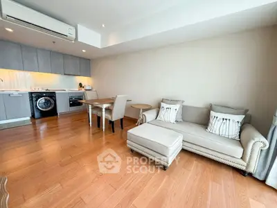 Modern living room with open kitchen and stylish furniture