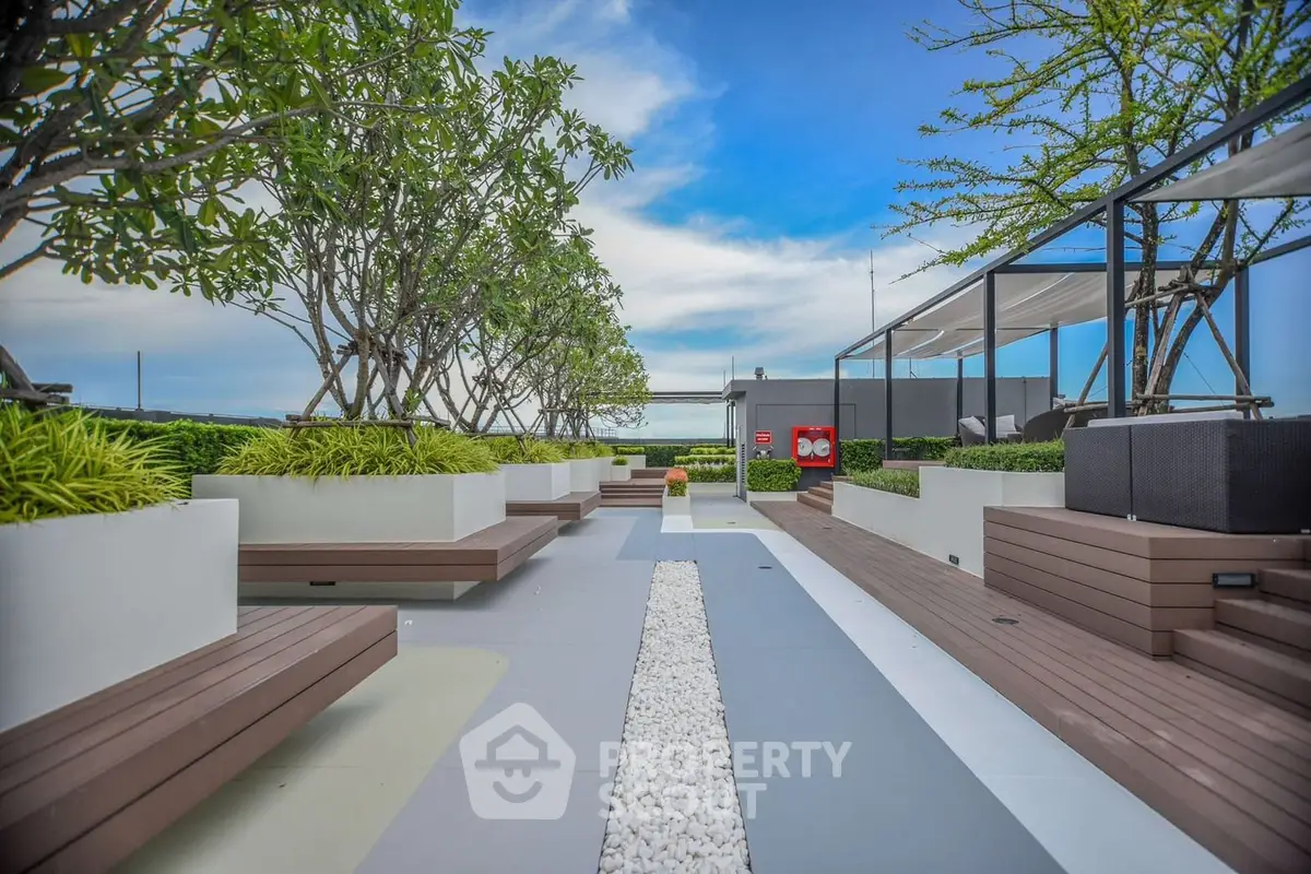 Luxurious rooftop garden with modern seating and lush greenery