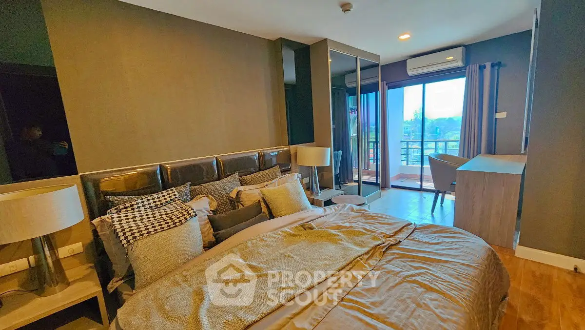 Luxurious bedroom with balcony and modern decor, featuring a cozy bed and stylish lighting.