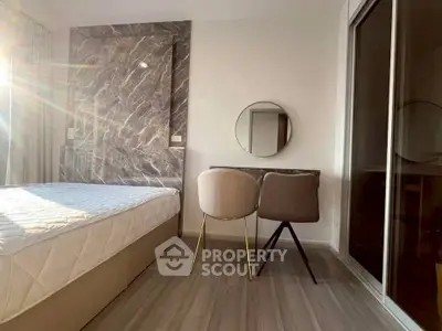 Modern bedroom with stylish decor and natural light