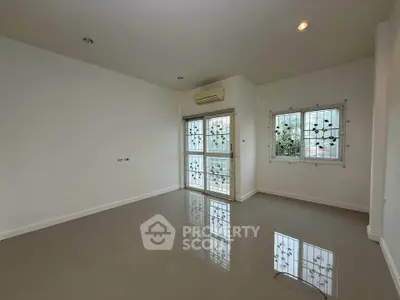 Spacious empty room with large windows and glossy tiled floor, perfect for customization.