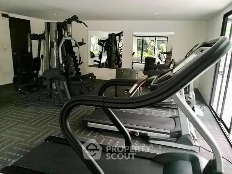 Modern gym with state-of-the-art equipment in a residential building, offering a healthy lifestyle for residents.