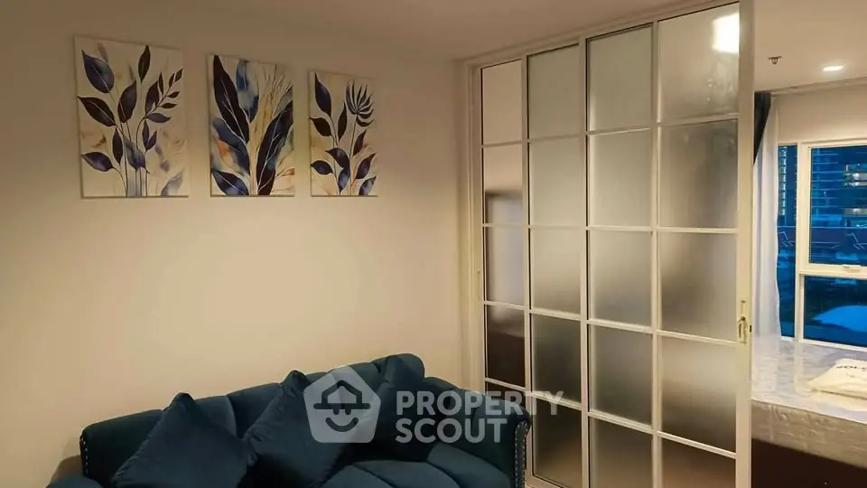 Stylish living room with blue sofa and modern decor
