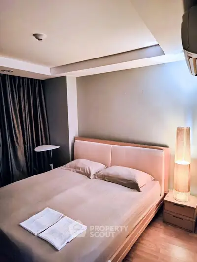 Cozy bedroom with modern lighting and elegant decor