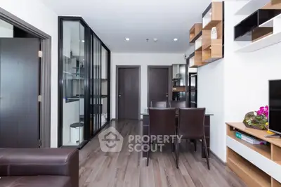 Modern living room with sleek furniture and stylish shelving in a contemporary apartment.