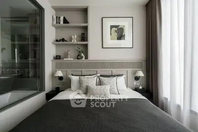 Modern bedroom with stylish decor and large window for natural light.