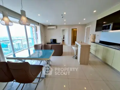 Spacious modern living room with open kitchen and stunning city view