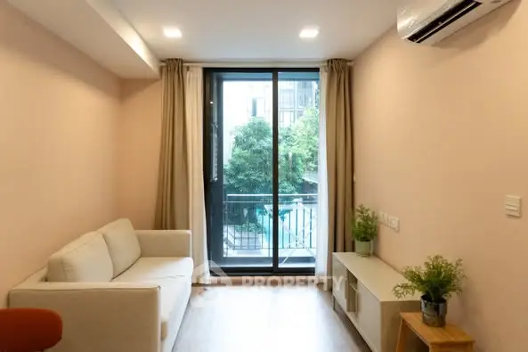 Cozy living room with modern decor and balcony view