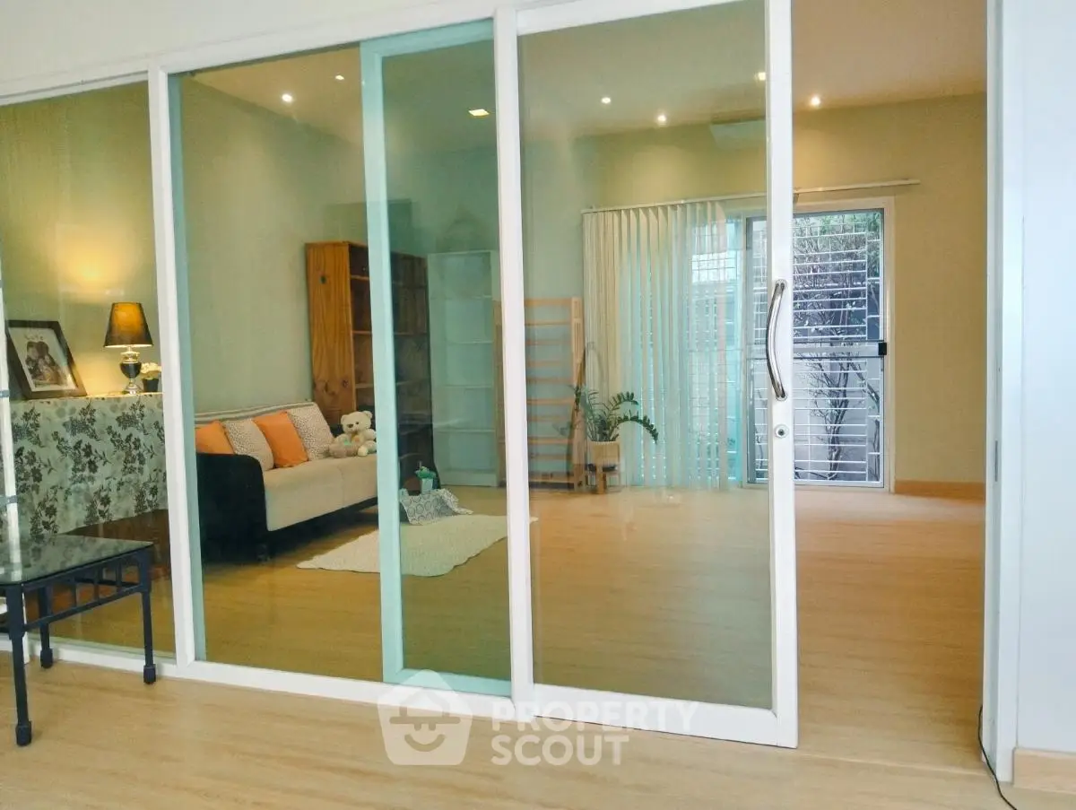 Spacious living room with sliding glass doors and elegant decor