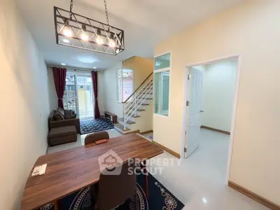 Modern living room with stylish lighting and cozy seating area in a contemporary home.