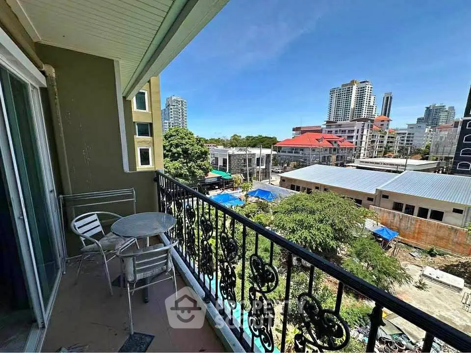 Charming balcony with city view, perfect for relaxing and enjoying the urban skyline.