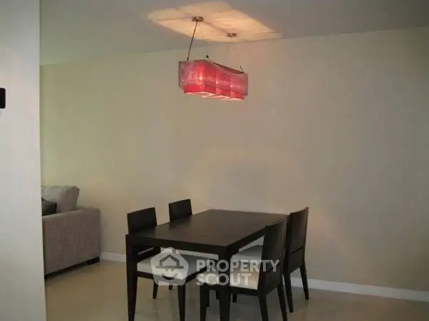 Modern dining area with elegant lighting and sleek furniture