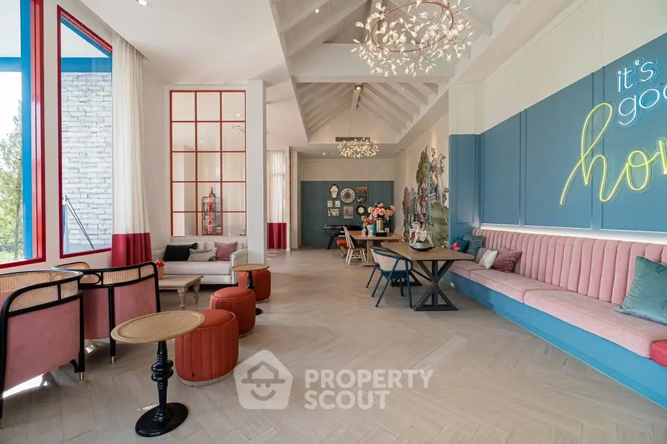 Stylish modern living room with chic decor and ample seating in a bright, airy space.