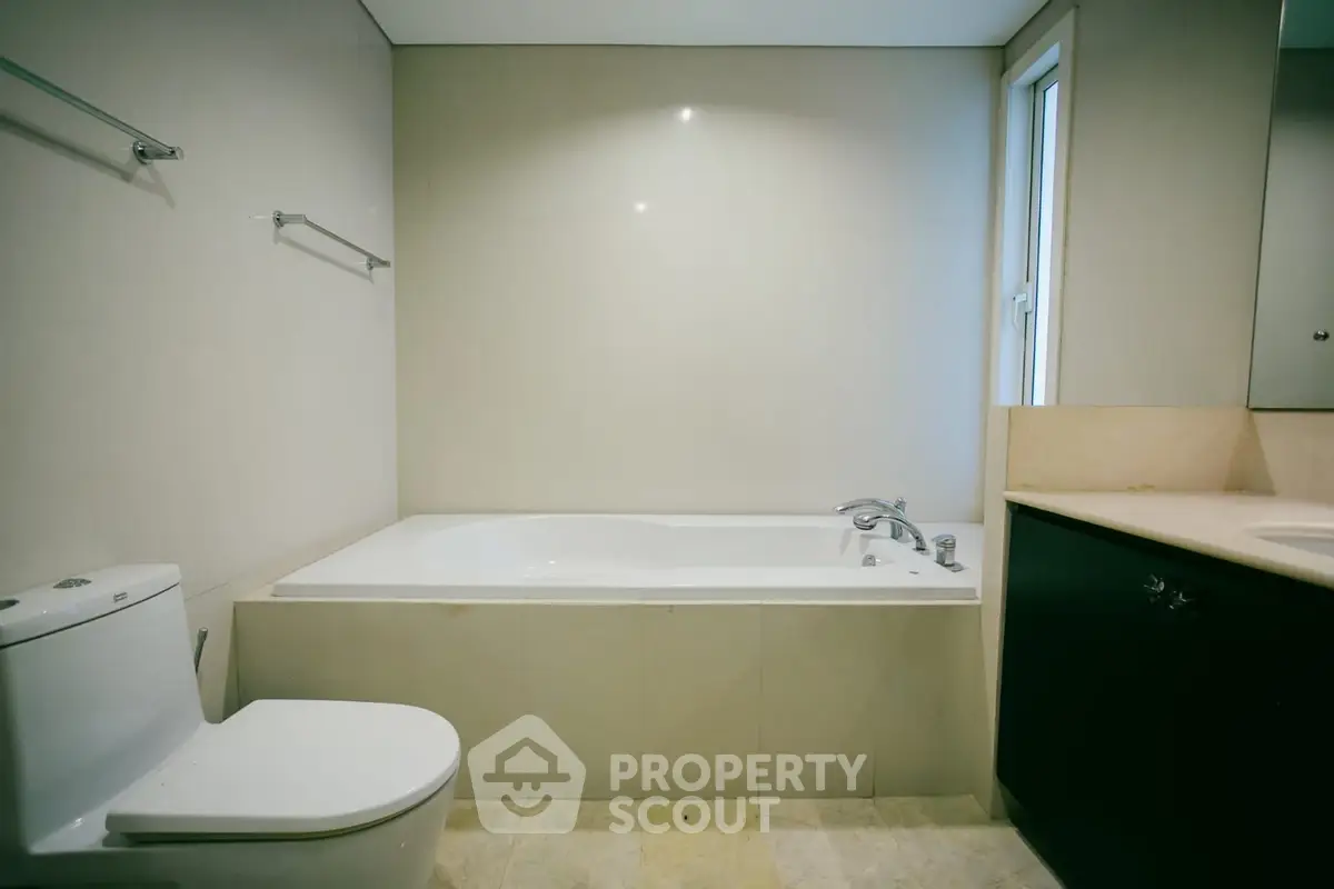 Spacious bathroom with modern bathtub and sleek fixtures