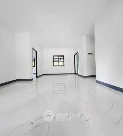 Spacious modern interior with glossy marble flooring and minimalist design.