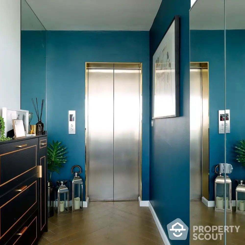 Stylish modern elevator lobby with blue walls and chic decor