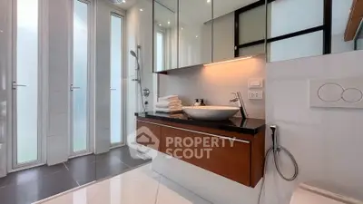 Modern bathroom with sleek fixtures and large windows