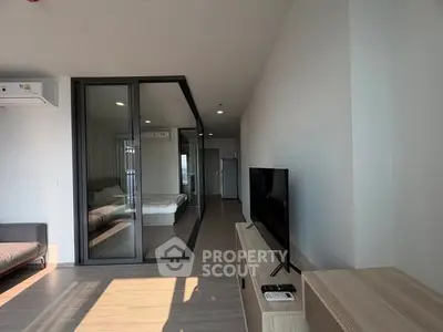 Modern apartment with glass partition and sleek interior design